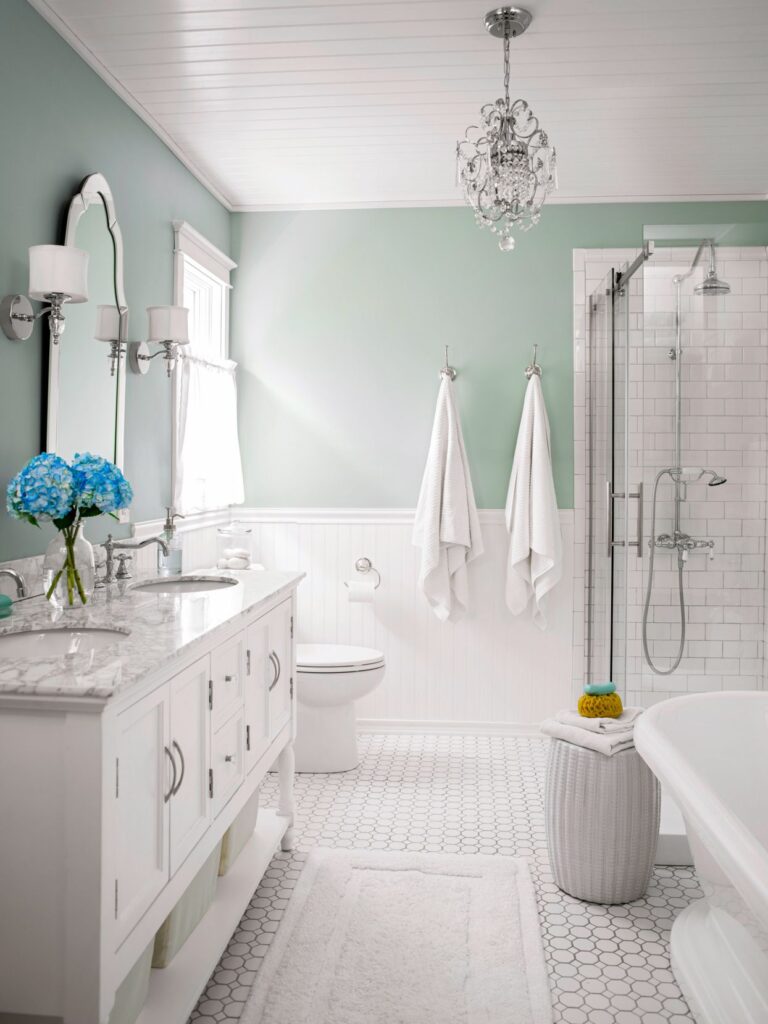 A view of a bathroom with white color muted tone for a beach look