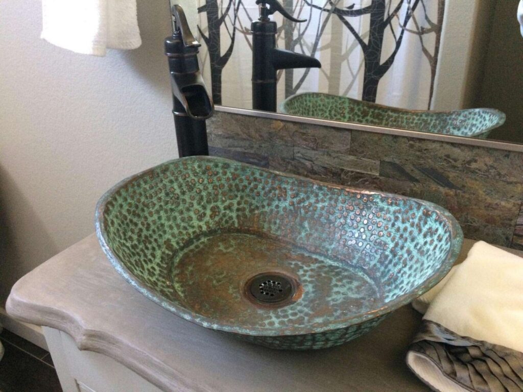 A view of an aged green patina installed in bathroom for a rustic look