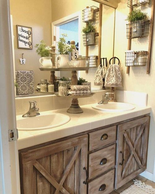 different decorative items and plants set on the vanity in bathroom