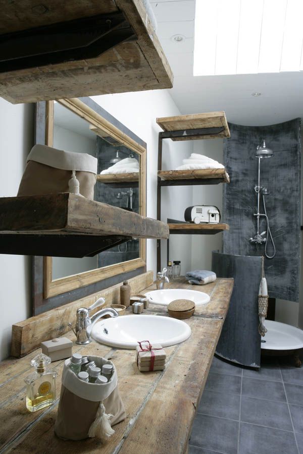 natural materials in gray bathroom sinks faucets wooden floating shelves and wooden countertops