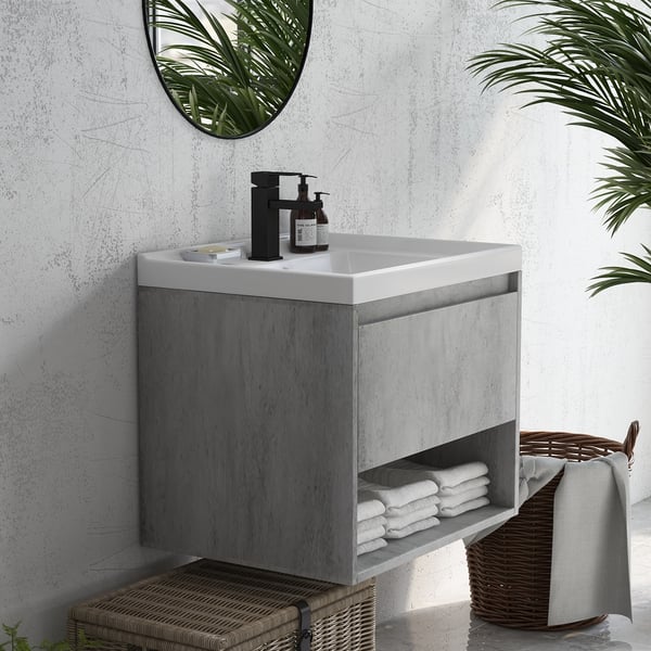 small floating gray vanity in a bathroom