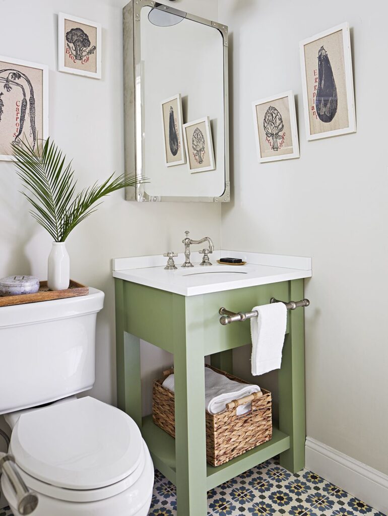 a green theme small bathroom with under sink storage space