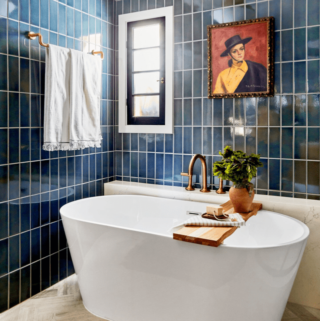 blue wall tiles in a white and blue theme bathroom