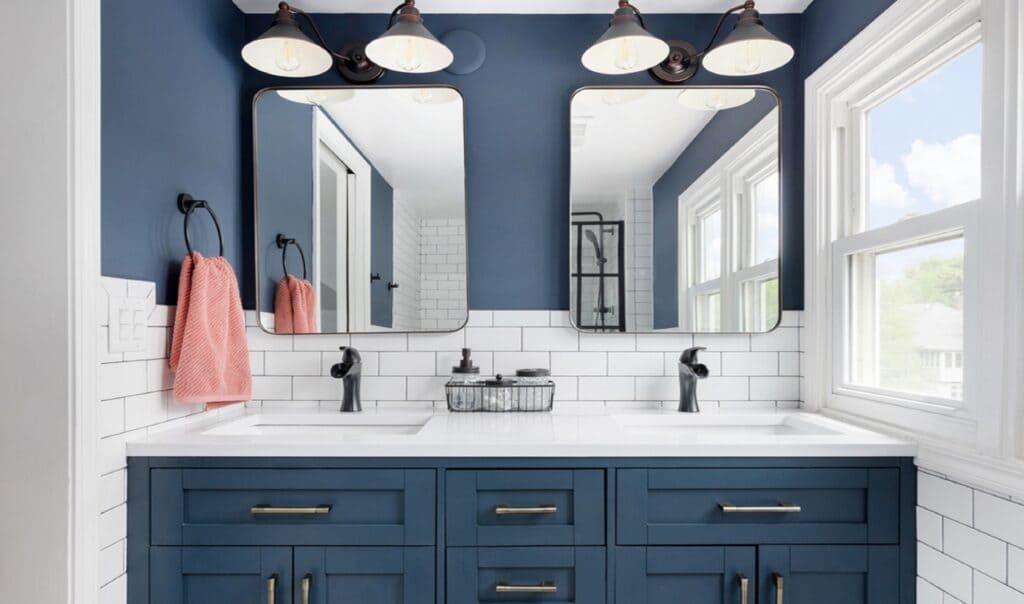 mirror in a blue color theme bathroom