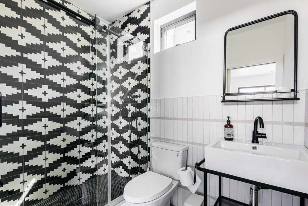 graphic black and white patterns on the wall of bathroom