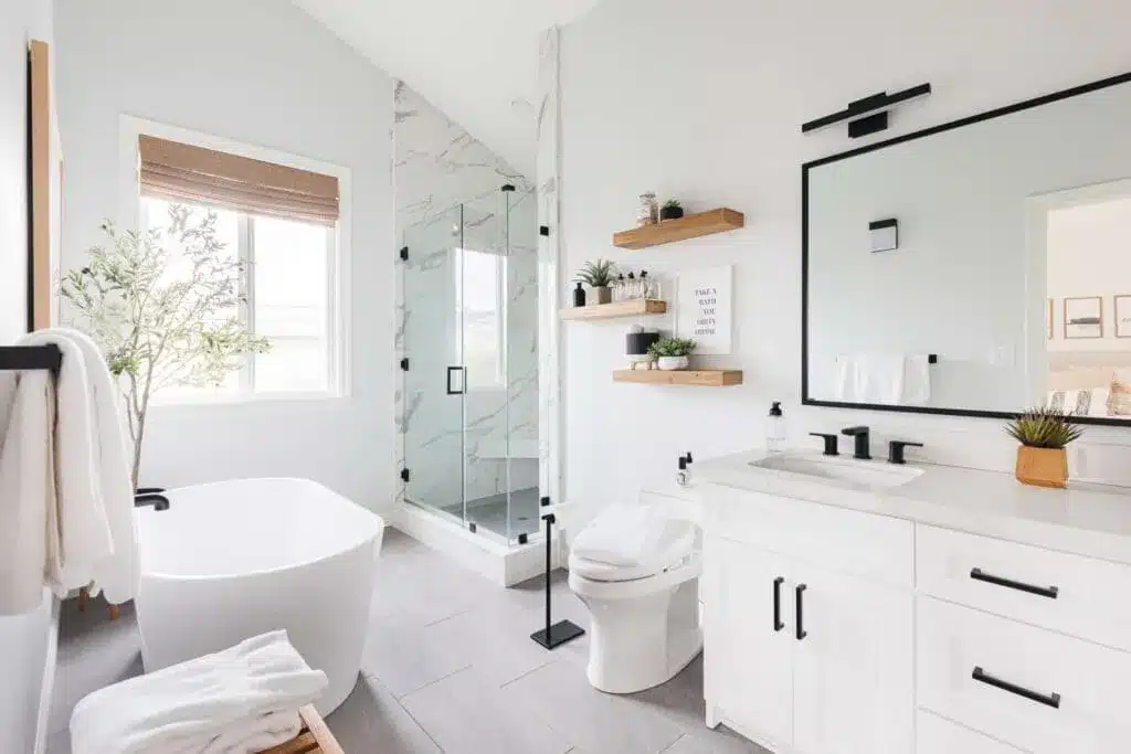 small master bathroom in white color white vanity white bathtub and wall paint