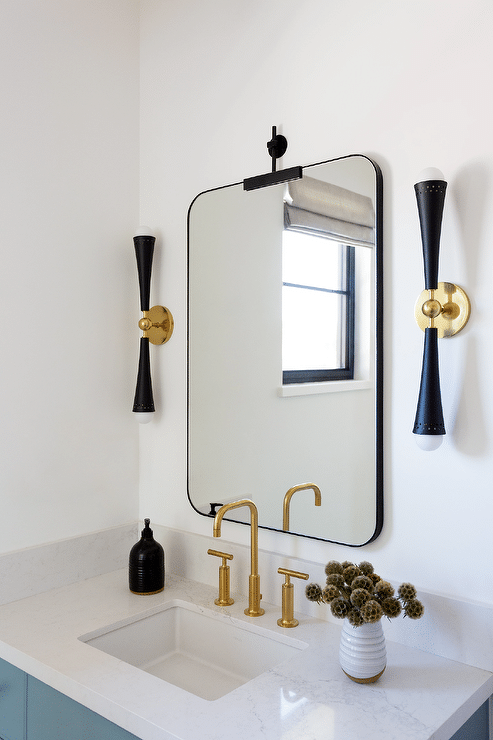 A view of a camouflage bathroom mirror over a sink