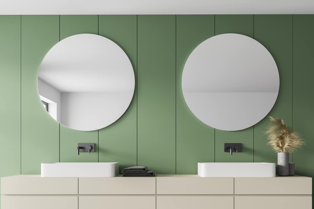 Light Bathroom With White Sinks And Round Mirrors 