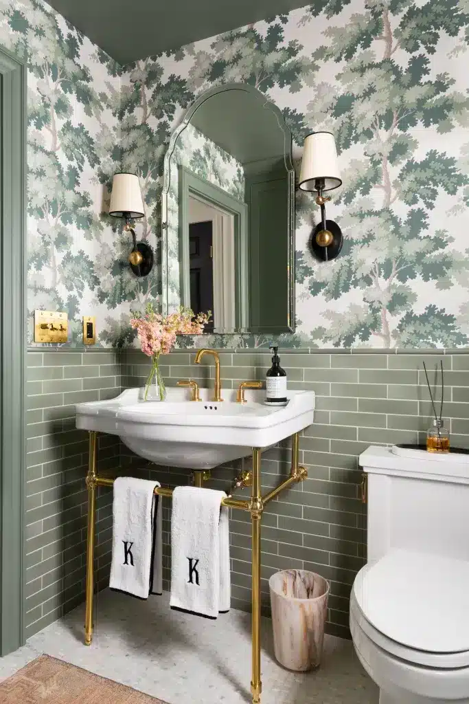 patterned ceramic tiles in bathroom walls a sink lights along the mirror