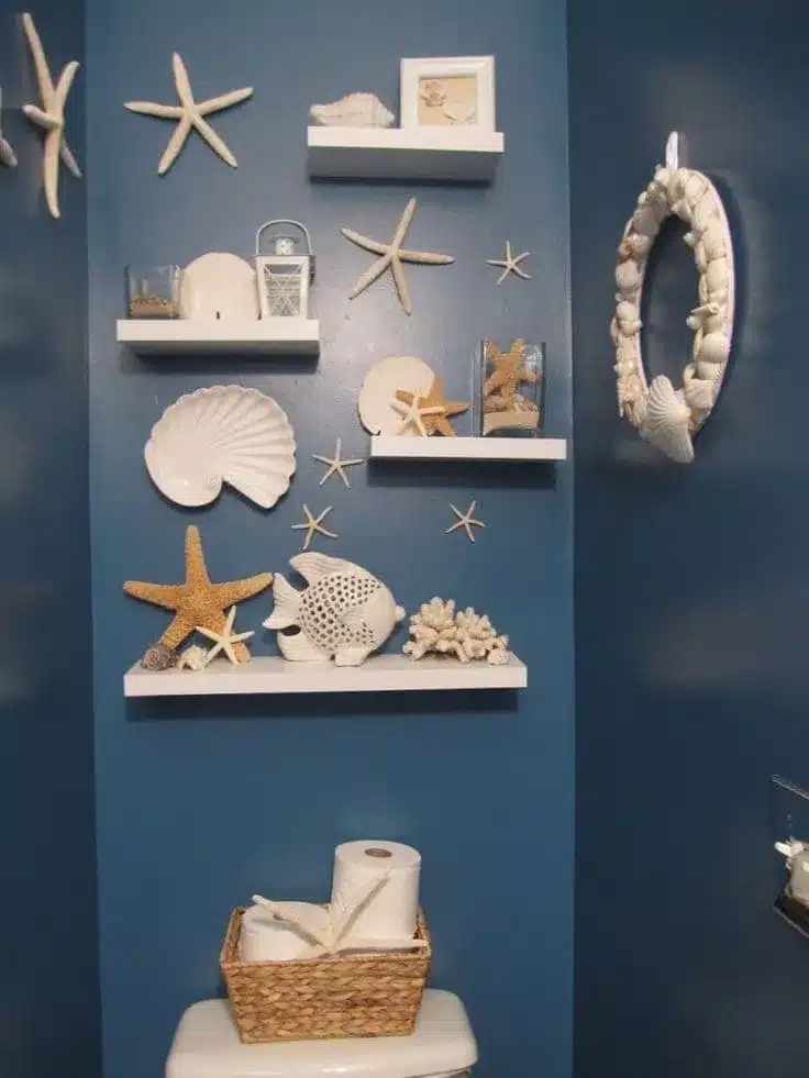 seashell decor on floating shleves in bathroom