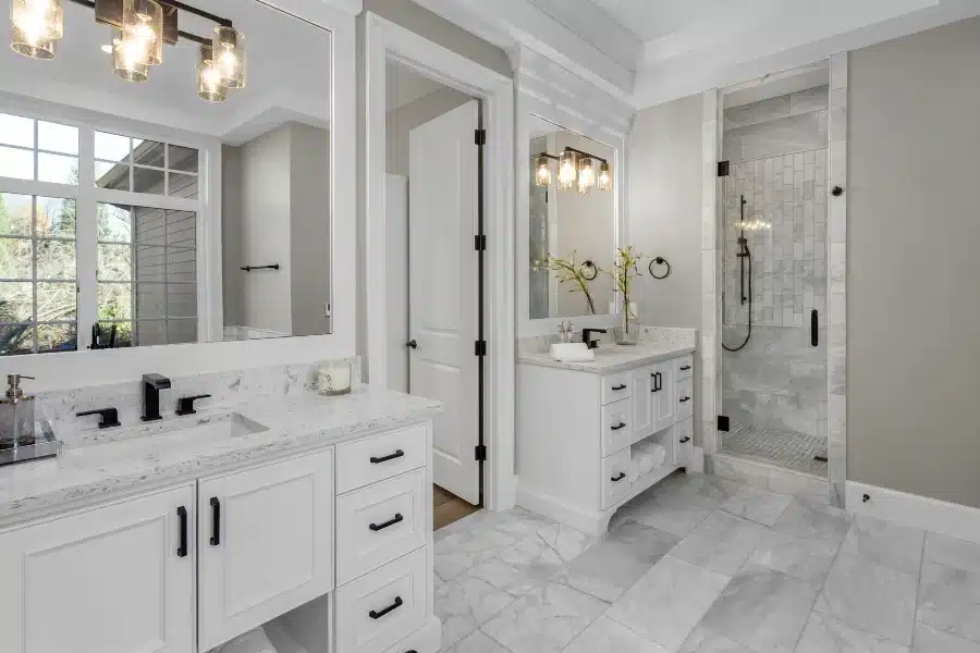 white themed jack and jill bathroom with separate vanities