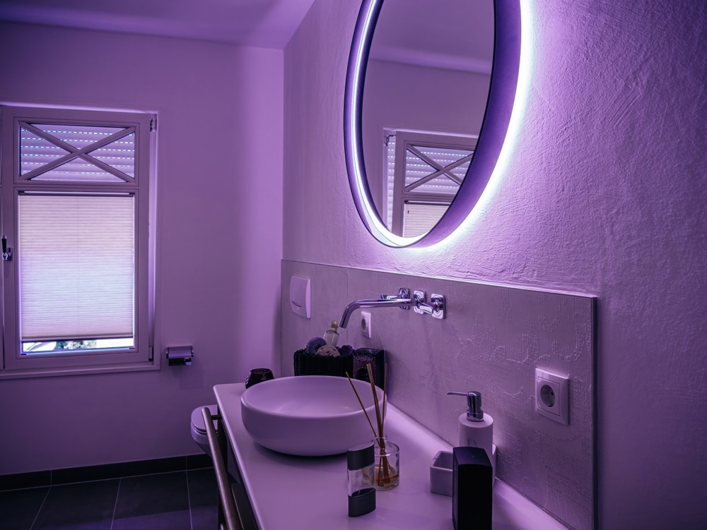 An Intimate Bathroom Setting Bathed In A Violet Hue 