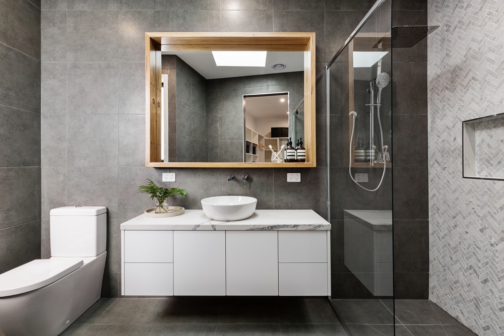 Modern Grey Designer Bathroom With Herringbone Shower Tiling