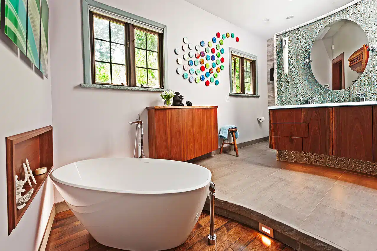 marble wall in a bathroom a bathtub towels hanging