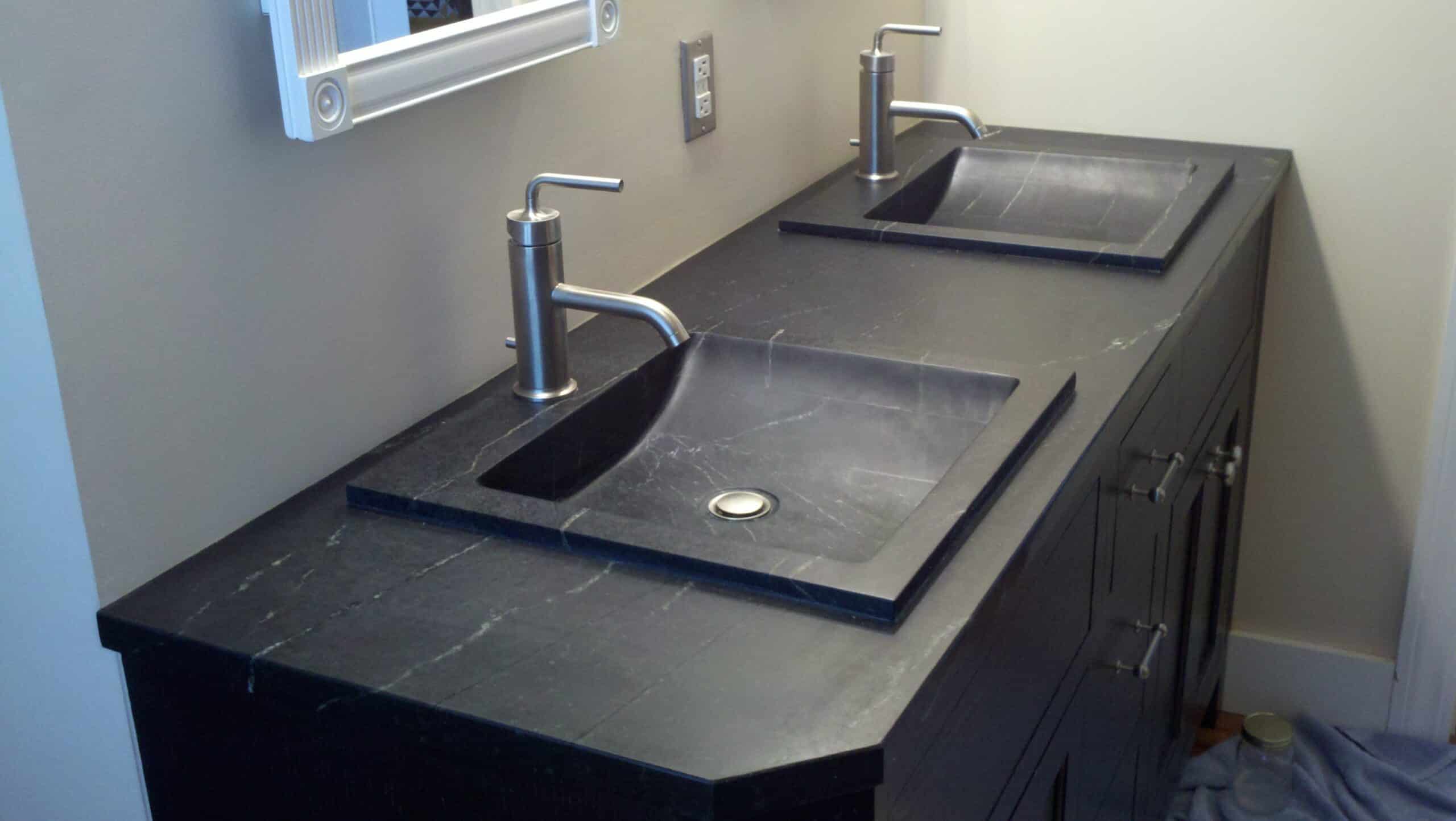 soapstone sinks and vanity in bathroom in black color