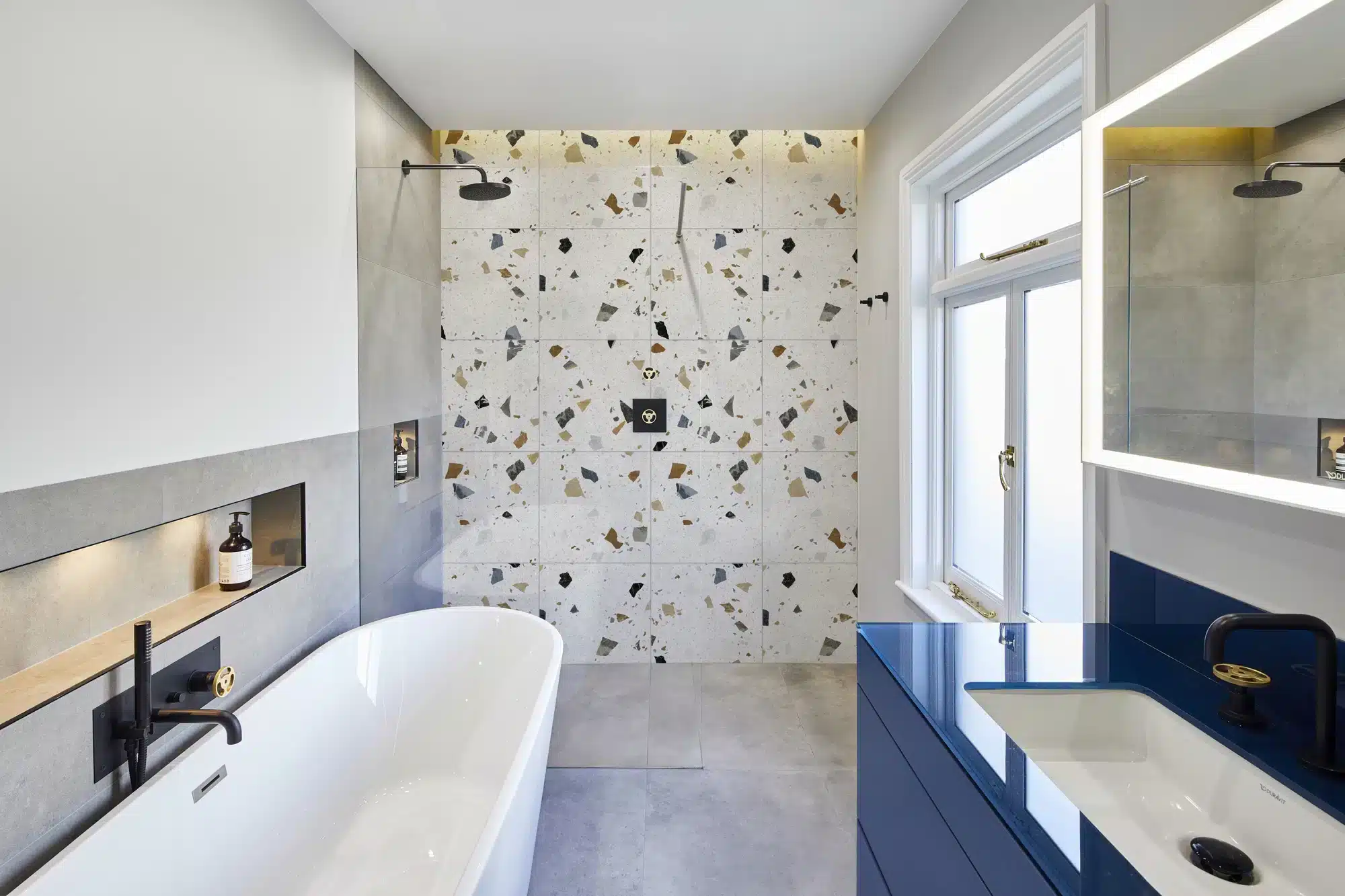 terrazzo wall in bathroom, a bathtub