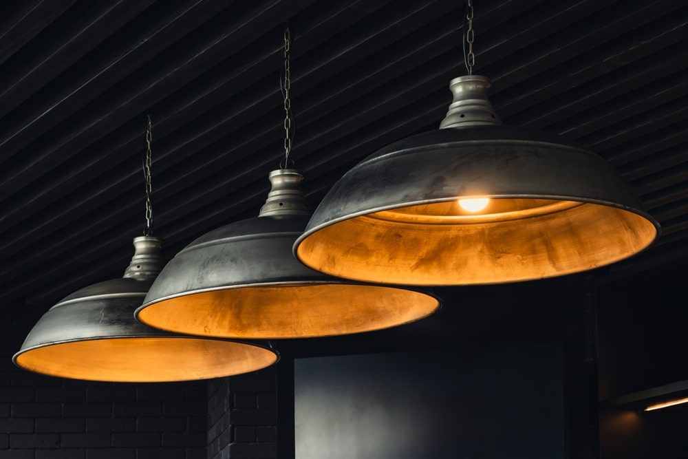 Three industrial-style chandeliers